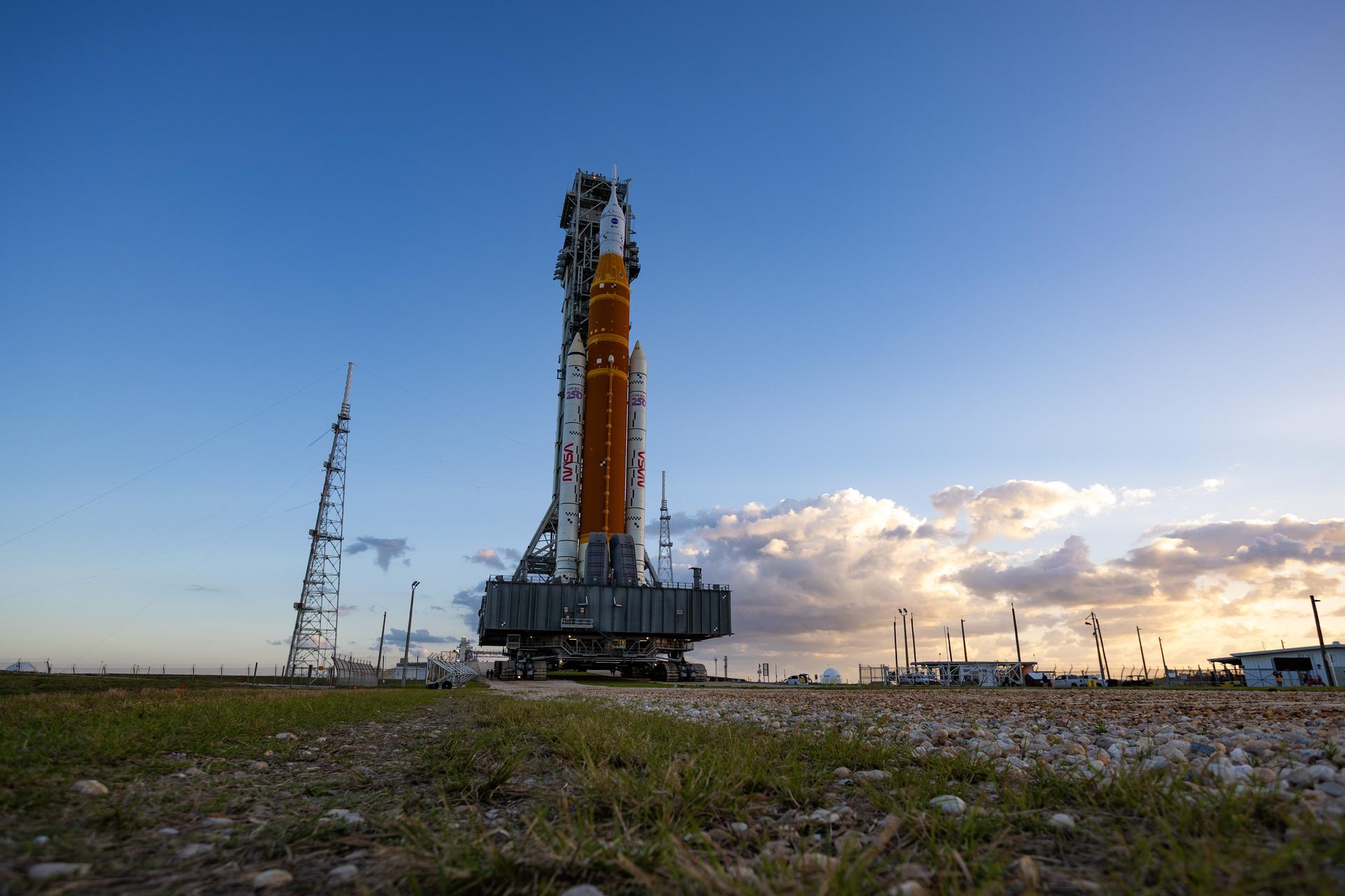 This image shows NASA’s SLS (Space Launch System) and Orion spacecraft rolling out of the Vehicle Assembly Building at NASA’s Kennedy Space Center. NASA's massive Crawler-Transporter, upgraded for the Artemis program, carries the powerful SLS rocket and Orion spacecraft on the Mobile Launcher from the Vehicle Assembly Building to Launch Pad 39B at Kennedy Space Center in preparation for the Artemis II mission.